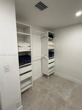 a view of an empty walk in closet