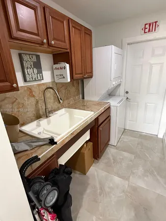 a kitchen with a stove and a refrigerator