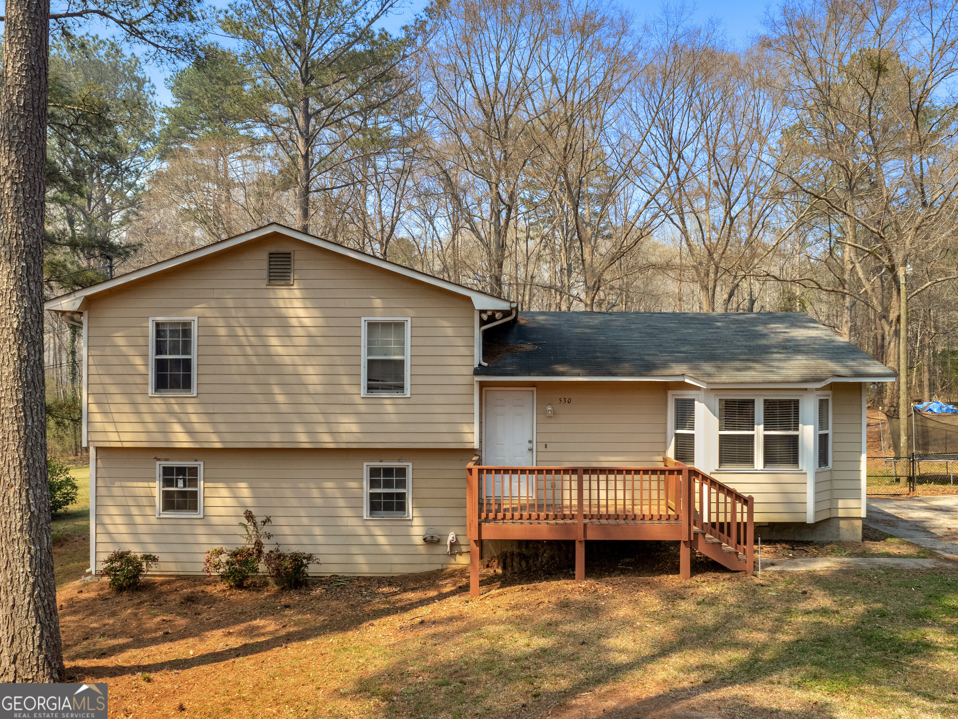 530 Welcome Road Newnan, GA 30263 - Photo 1 of 1 a front view of a house with a yard