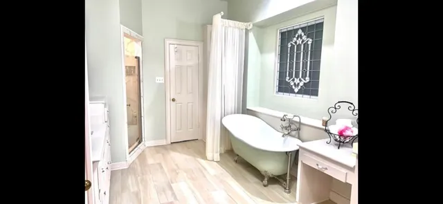 a bathroom with a sink mirror and a bathtub