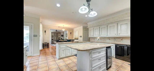 a view of a kitchen and dining room