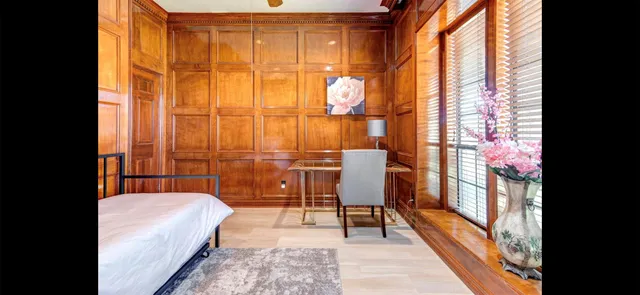 a balcony with table and chairs