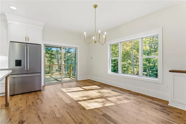a balcony with wooden floor and outdoor space
