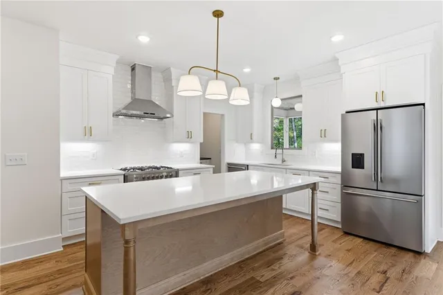 a spacious bathroom with a double vanity sink toilet mirror and shower