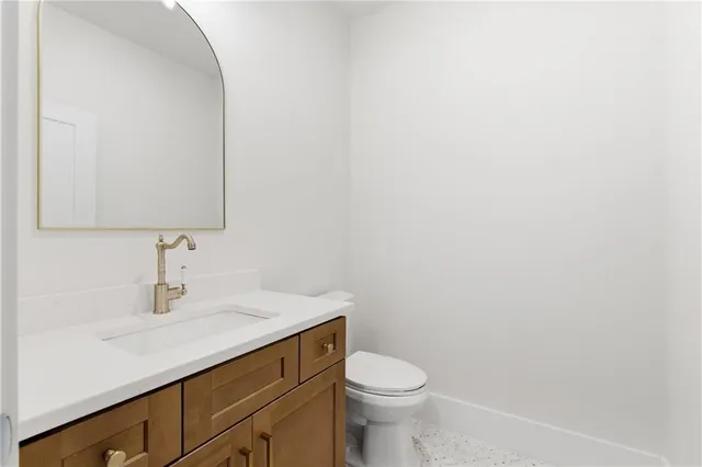 a view of a kitchen with a stove cabinets and a floor to ceiling window