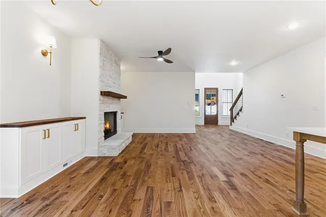a kitchen with a sink stainless steel appliances a counter space and wooden floor