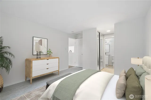 a bedroom with a bed and a dresser