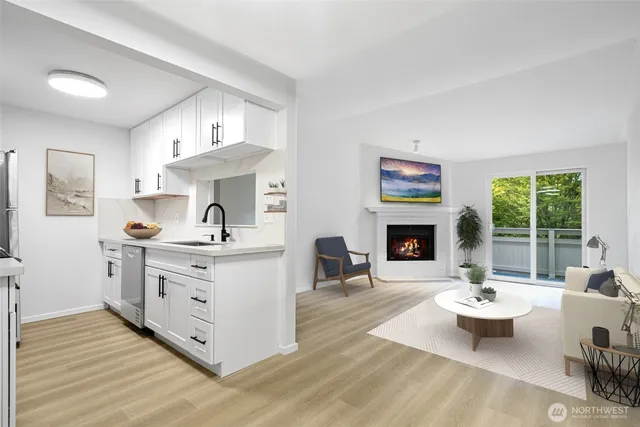 a living room with furniture fireplace and window