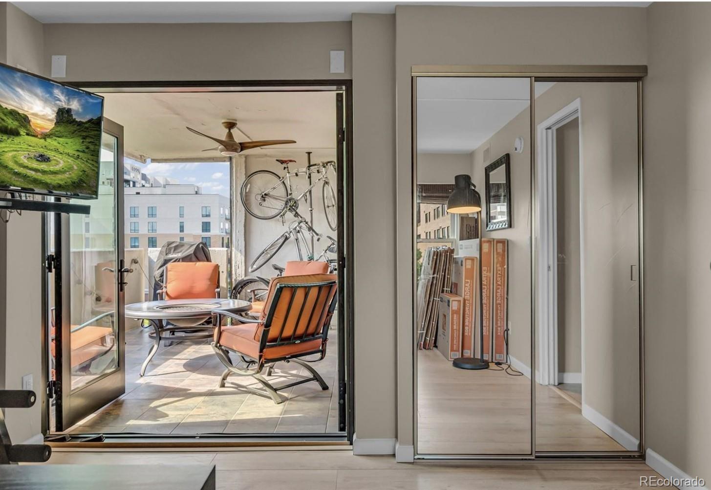 2 Adams Street, Unit 705 Denver, CO 80206 - Photo 19 of 50 a view of a hallway with dining area and glass door