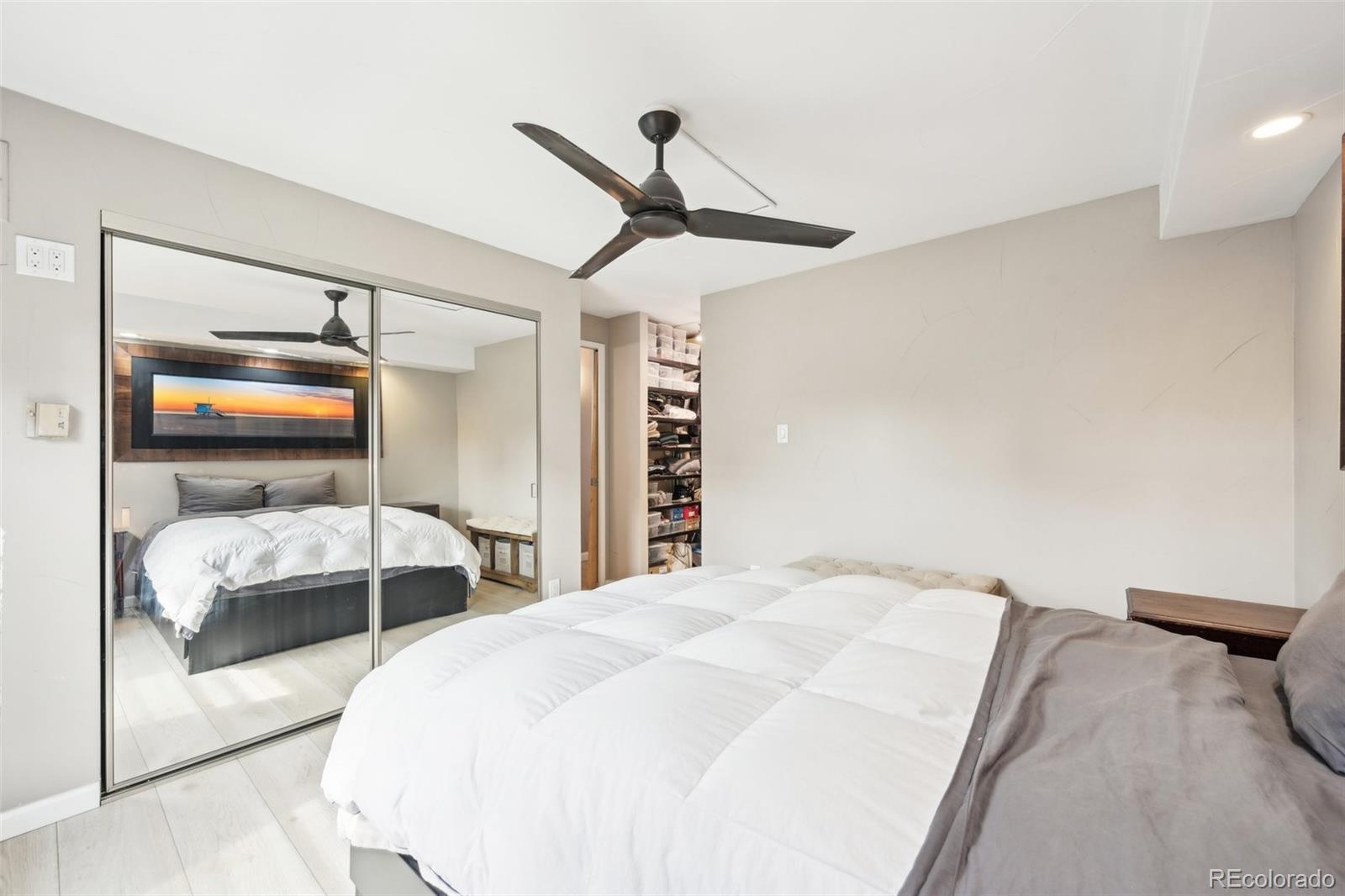 2 Adams Street, Unit 705 Denver, CO 80206 - Photo 27 of 50 a bedroom with a bed and a window