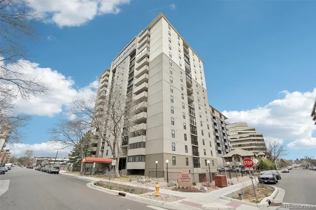 a tall building sitting on the side of a street