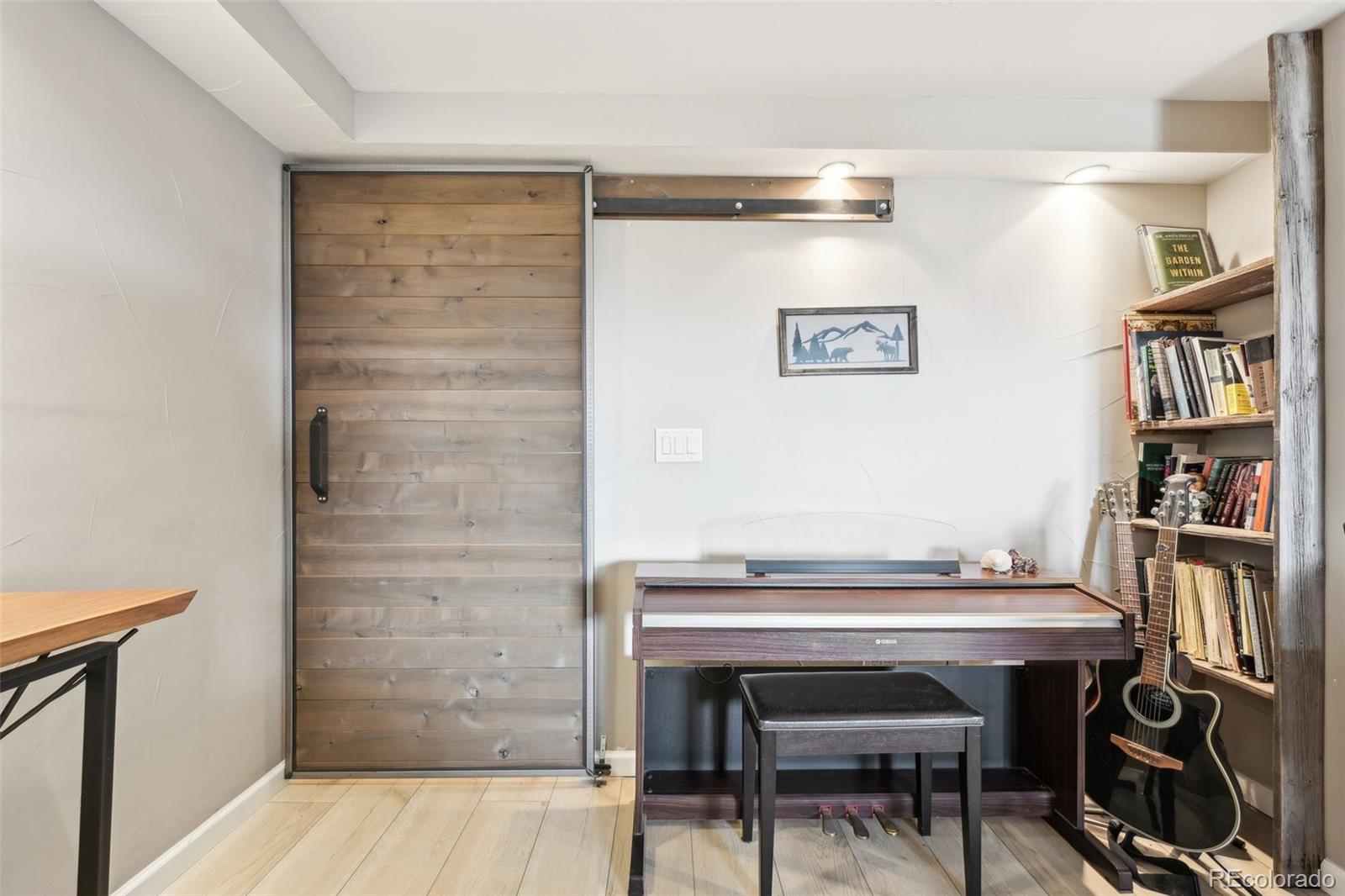 2 Adams Street, Unit 705 Denver, CO 80206 - Photo 32 of 50 a room with a table and chairs