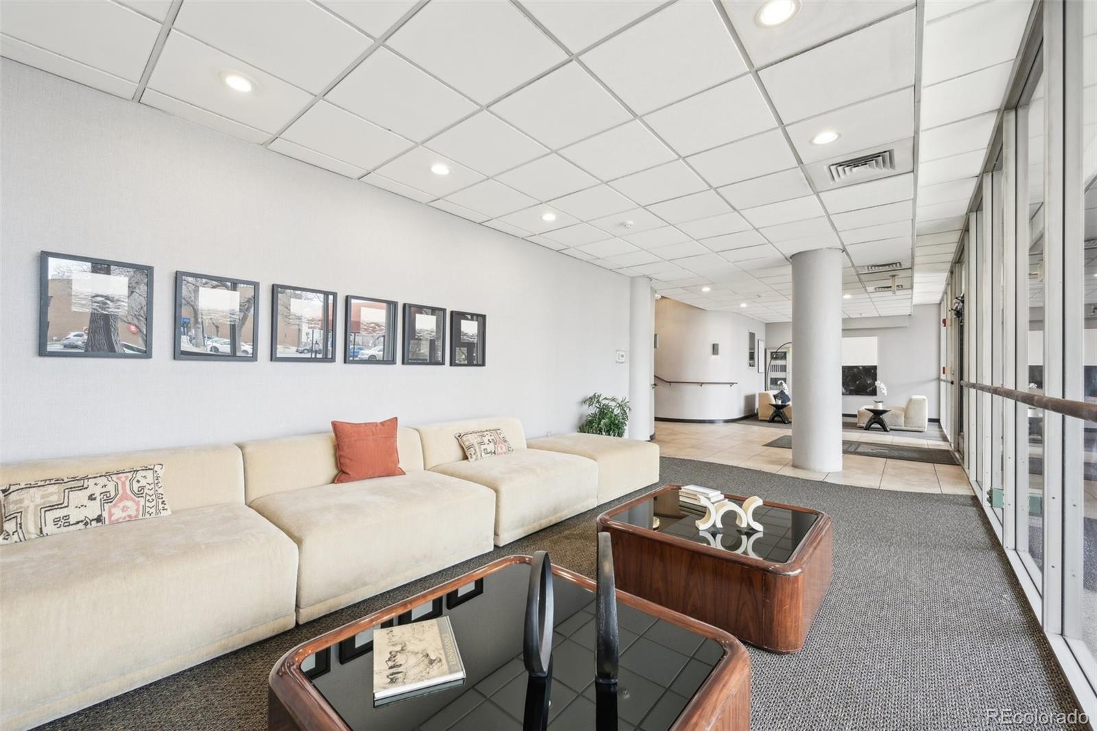2 Adams Street, Unit 705 Denver, CO 80206 - Photo 41 of 50 a living room with furniture and a table