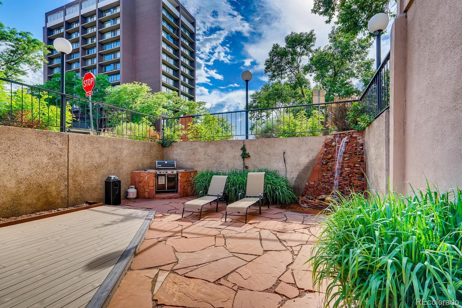 2 Adams Street, Unit 705 Denver, CO 80206 - Photo 42 of 50 a backyard of a house with lots of green space