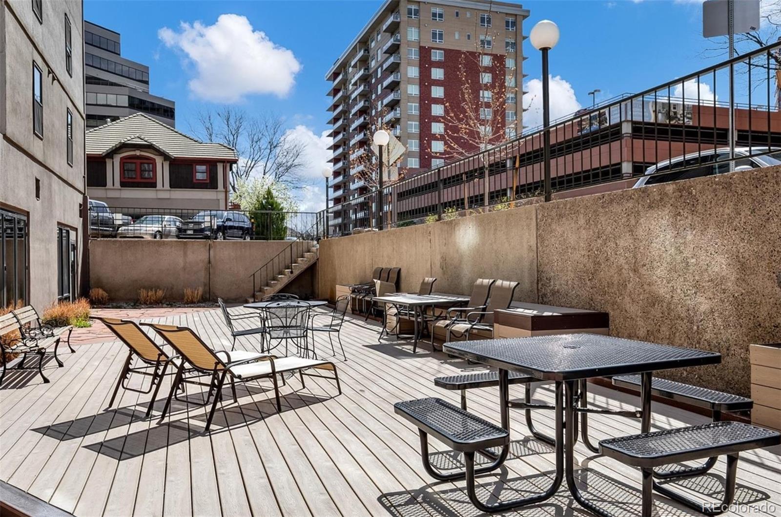 2 Adams Street, Unit 705 Denver, CO 80206 - Photo 43 of 50 a view of a chairs and table on the terrace