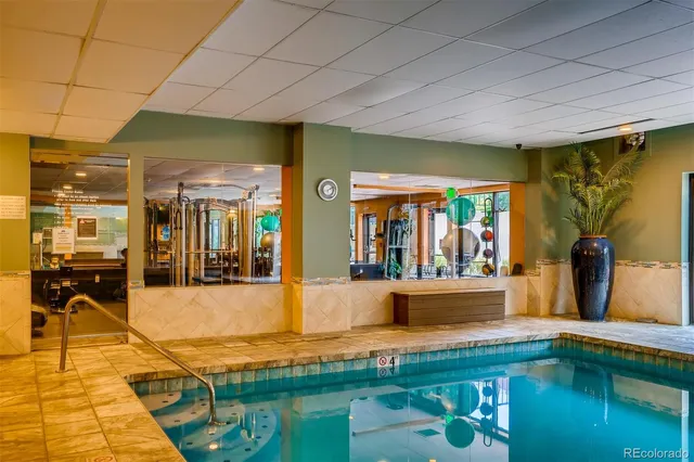 a room with lots of furniture and a chandelier