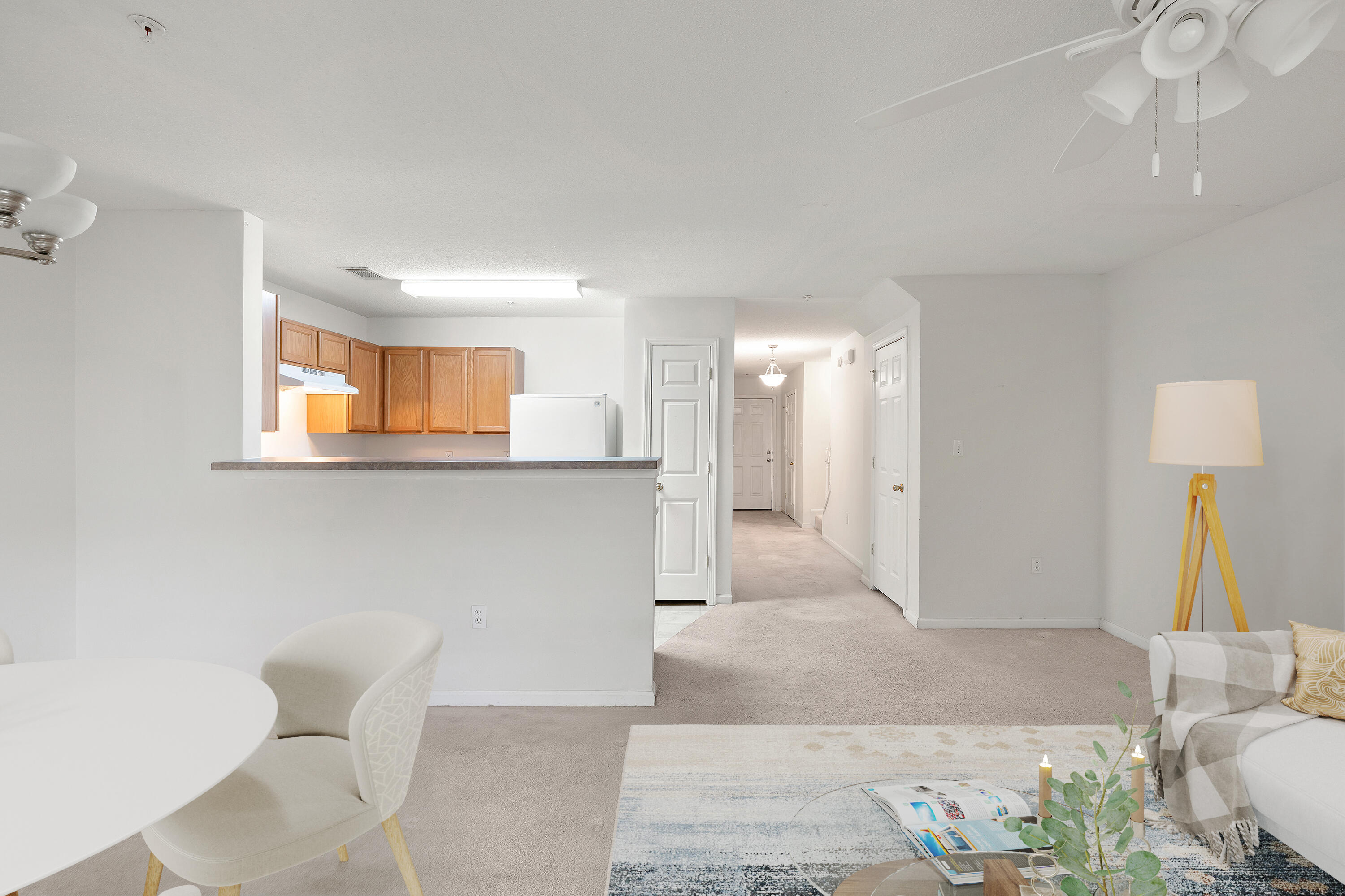 363 Crooked Pine Trail Crestview, FL 32539 - Photo 2 of 8 a living room with furniture and a lamp