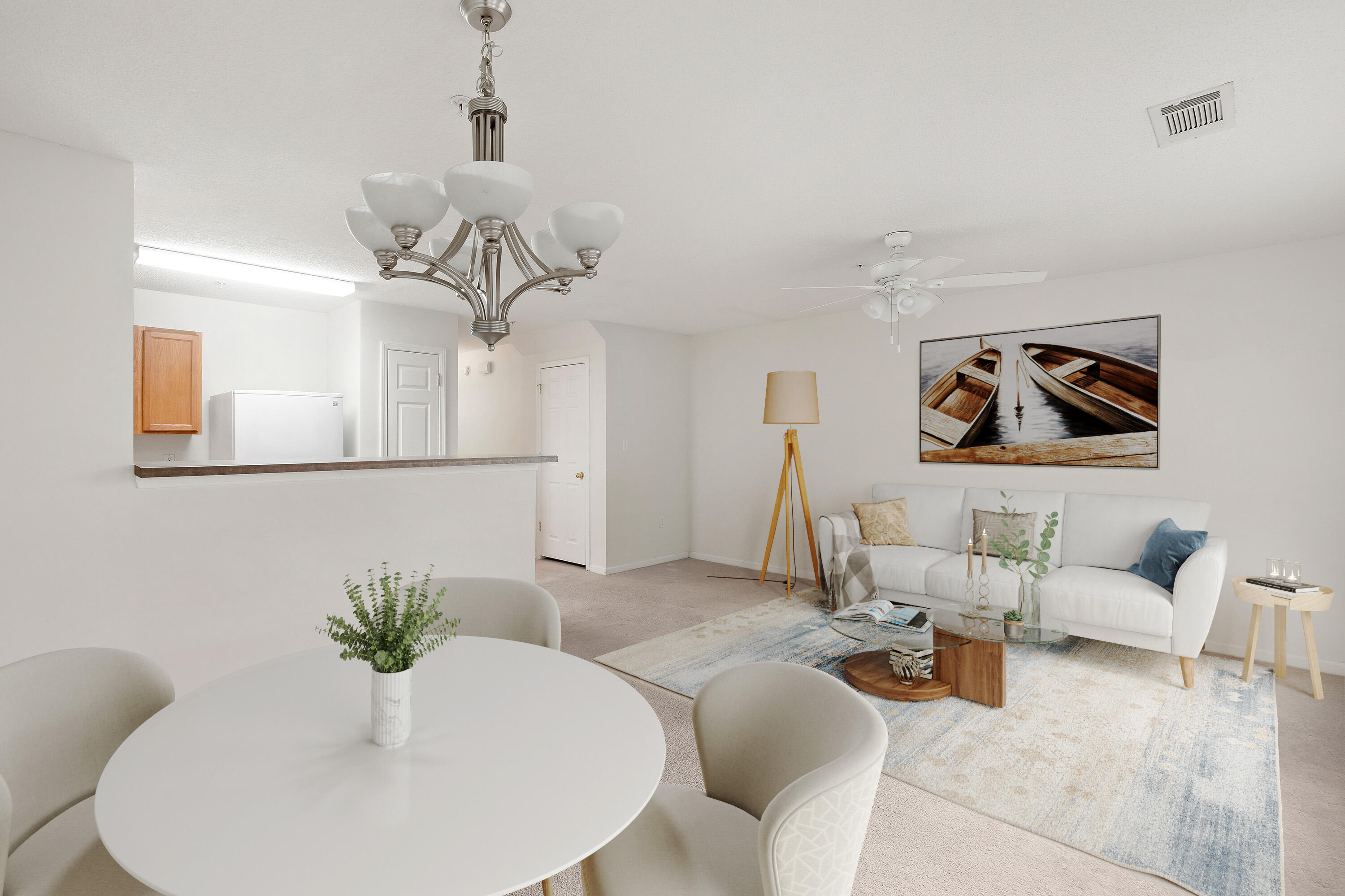 363 Crooked Pine Trail Crestview, FL 32539 - Photo 6 of 8 a living room with furniture flowers and a mirror