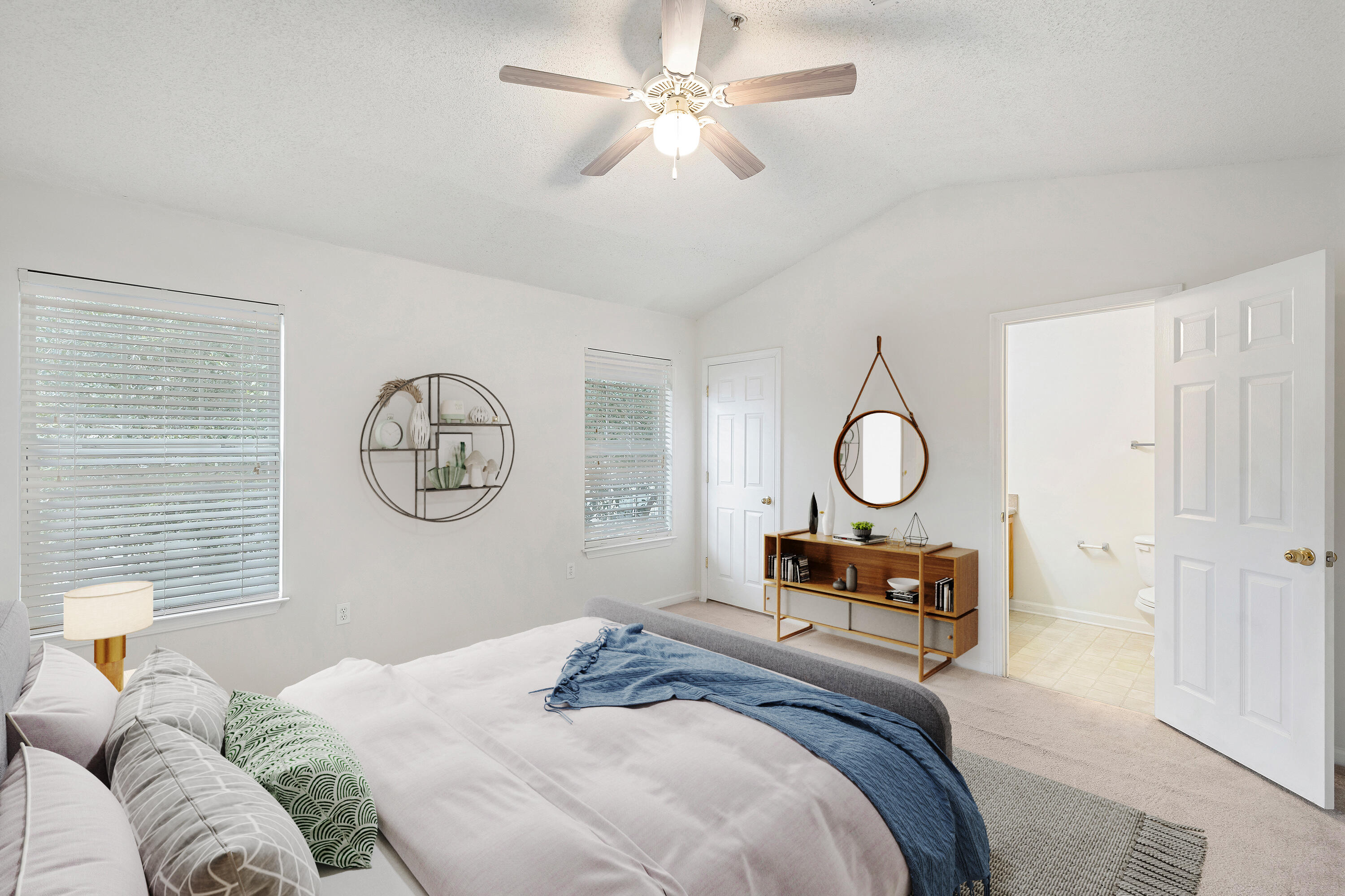 363 Crooked Pine Trail Crestview, FL 32539 - Photo 7 of 8 a bedroom with a bed and a chandelier