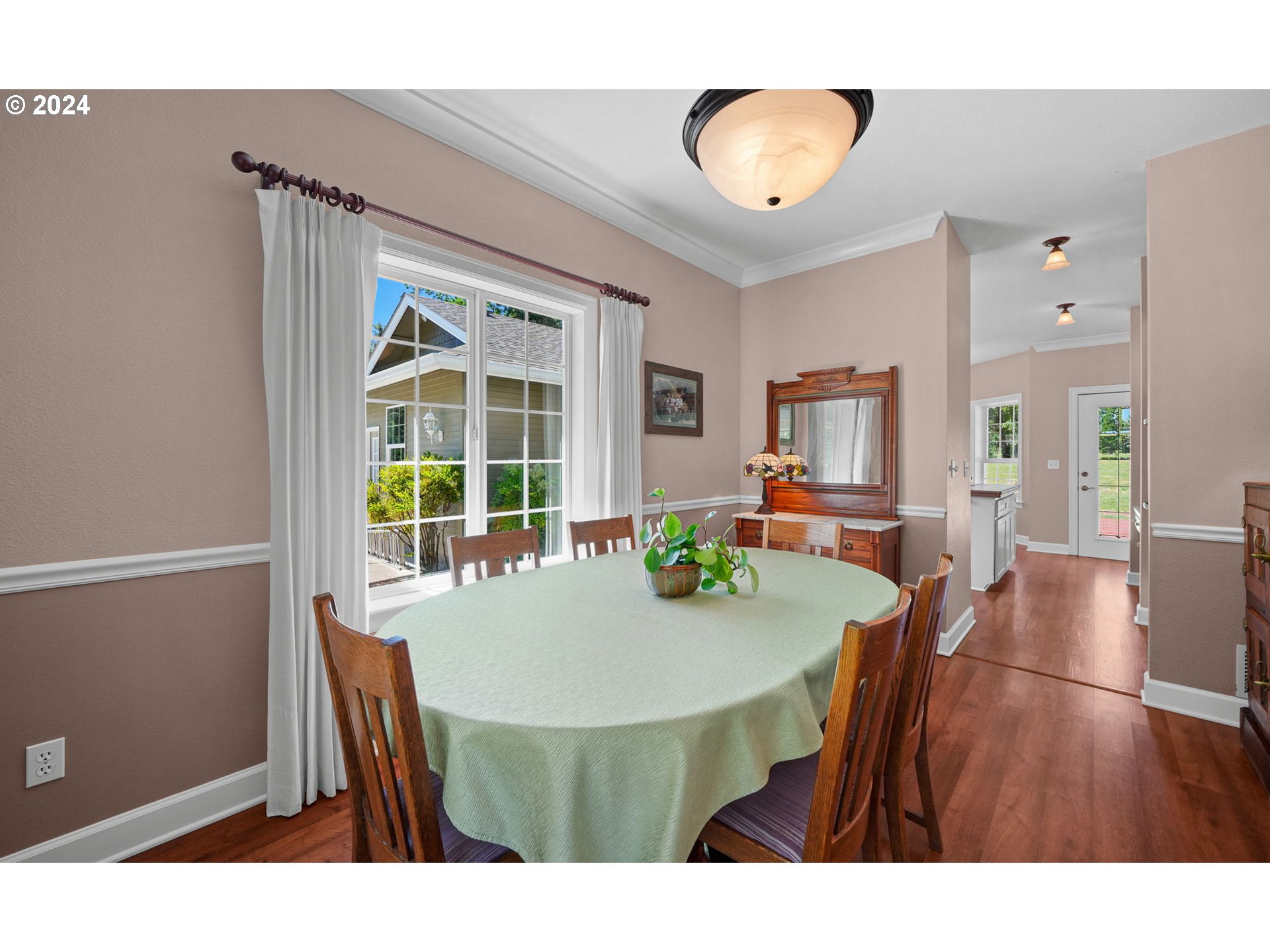 33482 Molitor Ranch Road Cottage Grove, OR 97424 - Photo 18 of 48 a view of a dining room with furniture and wooden floor