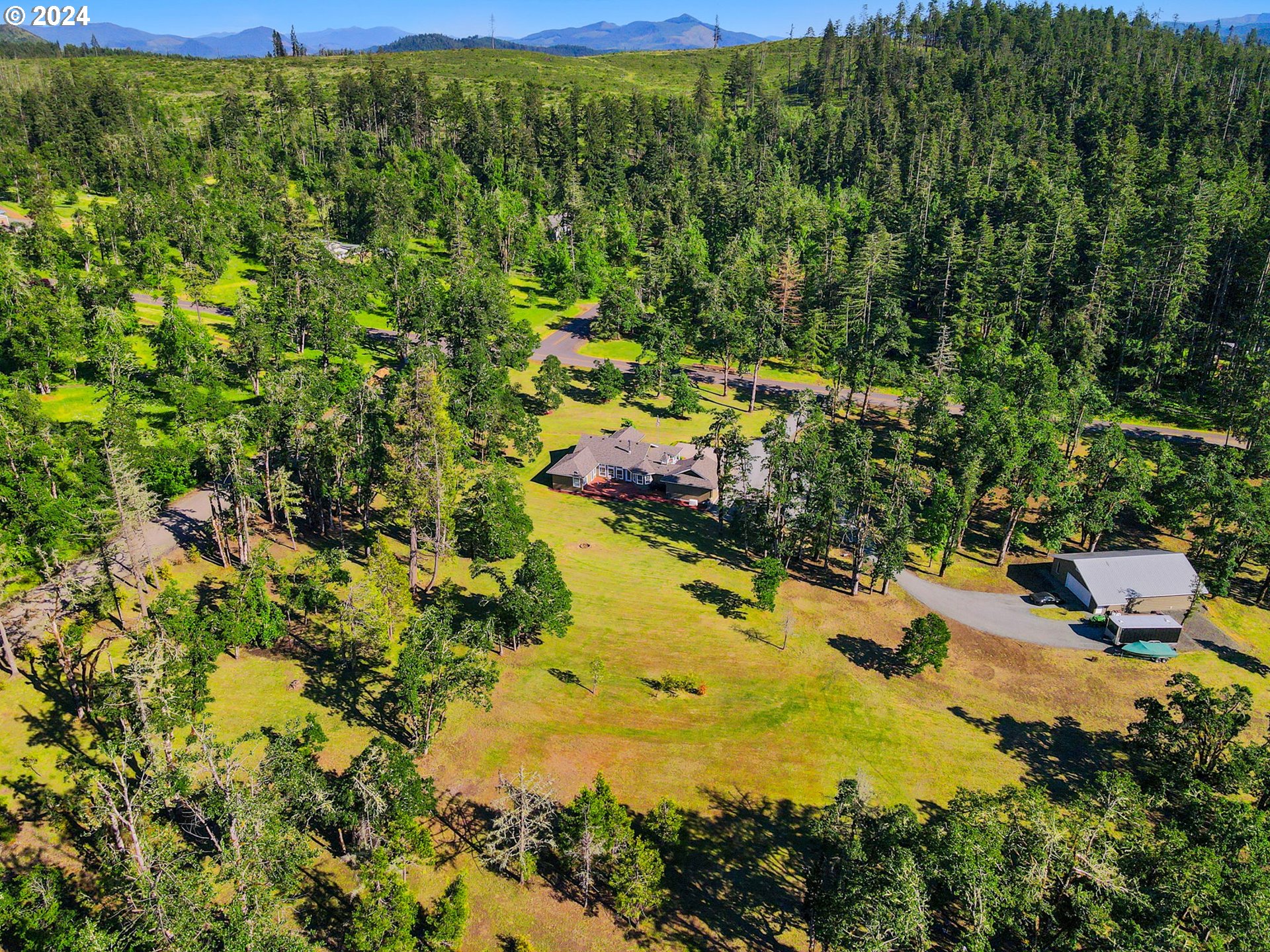 33482 Molitor Ranch Road Cottage Grove, OR 97424 - Photo 2 of 48 a view of a yard with plants