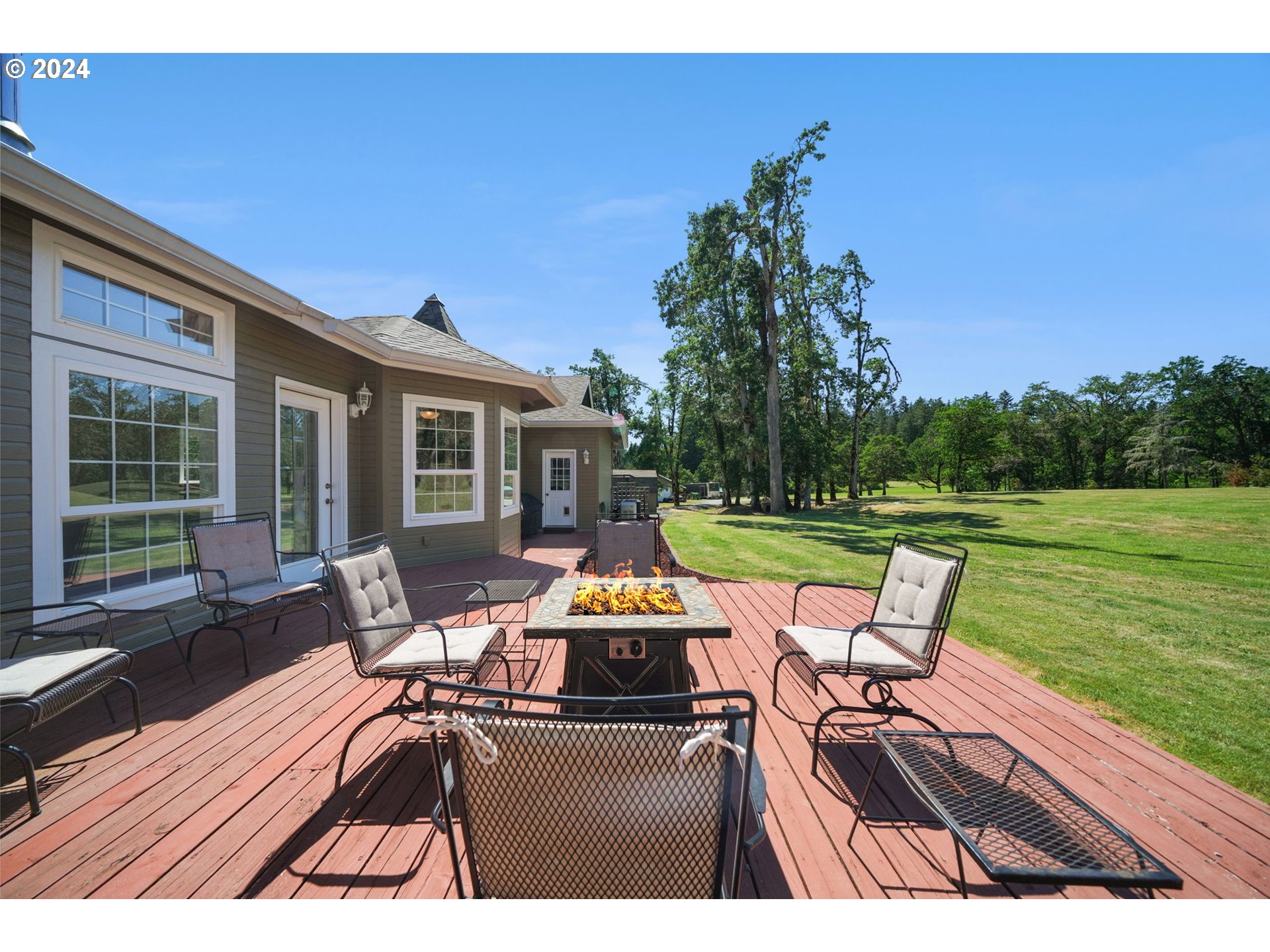 33482 Molitor Ranch Road Cottage Grove, OR 97424 - Photo 40 of 48 a view of a chairs and table in patio with a yard