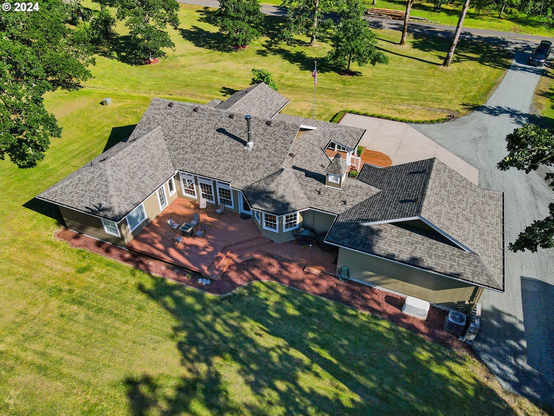 33482 Molitor Ranch Road Cottage Grove, OR 97424 - Photo 42 of 48 an aerial view of a house with garden space and a car parked