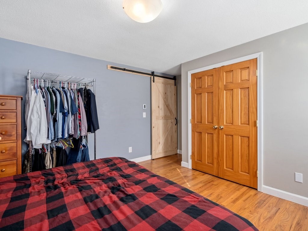 62 Middle Road Amesbury, MA 01913 - Photo 13 of 24 a bedroom with a bed and a closet