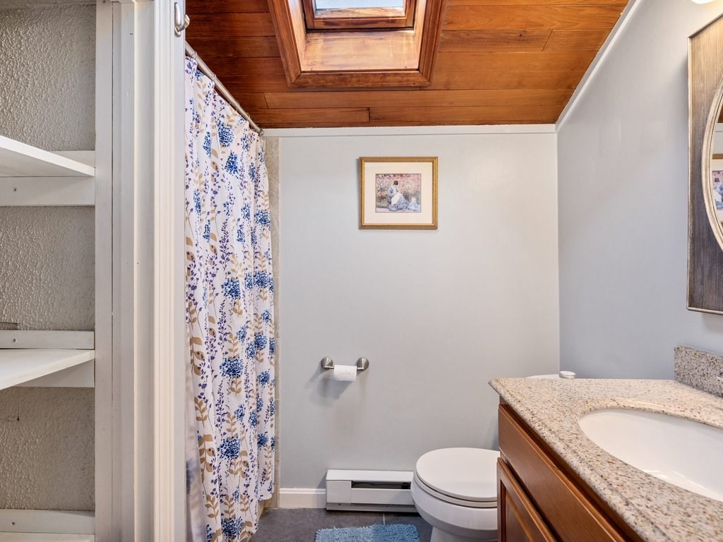 62 Middle Road Amesbury, MA 01913 - Photo 19 of 24 a bathroom with a granite countertop toilet and a sink
