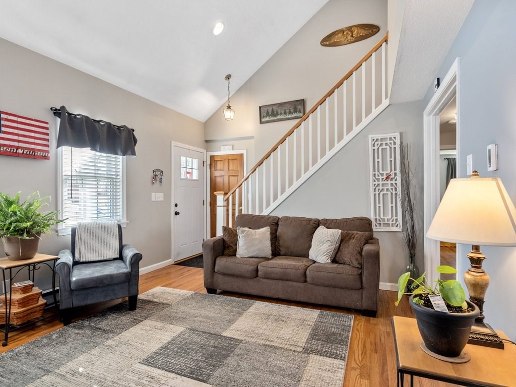 62 Middle Road Amesbury, MA 01913 - Photo 5 of 24 a living room with furniture fireplace and a potted plant