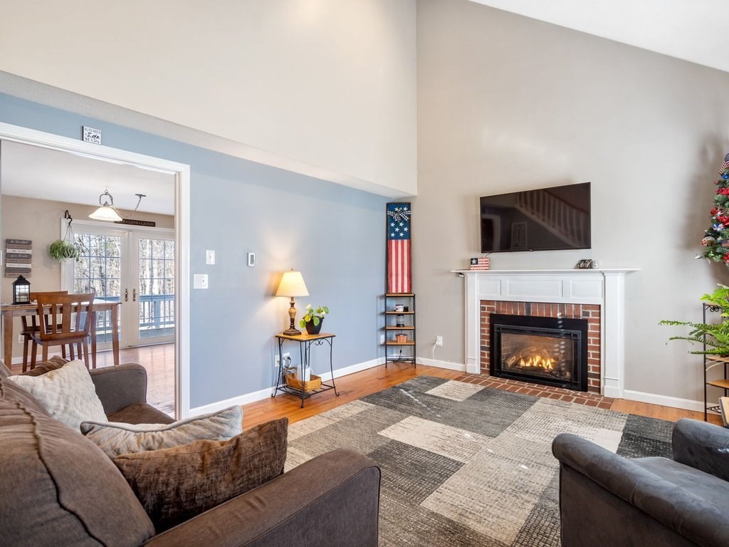 62 Middle Road Amesbury, MA 01913 - Photo 6 of 24 a living room with furniture and a fireplace