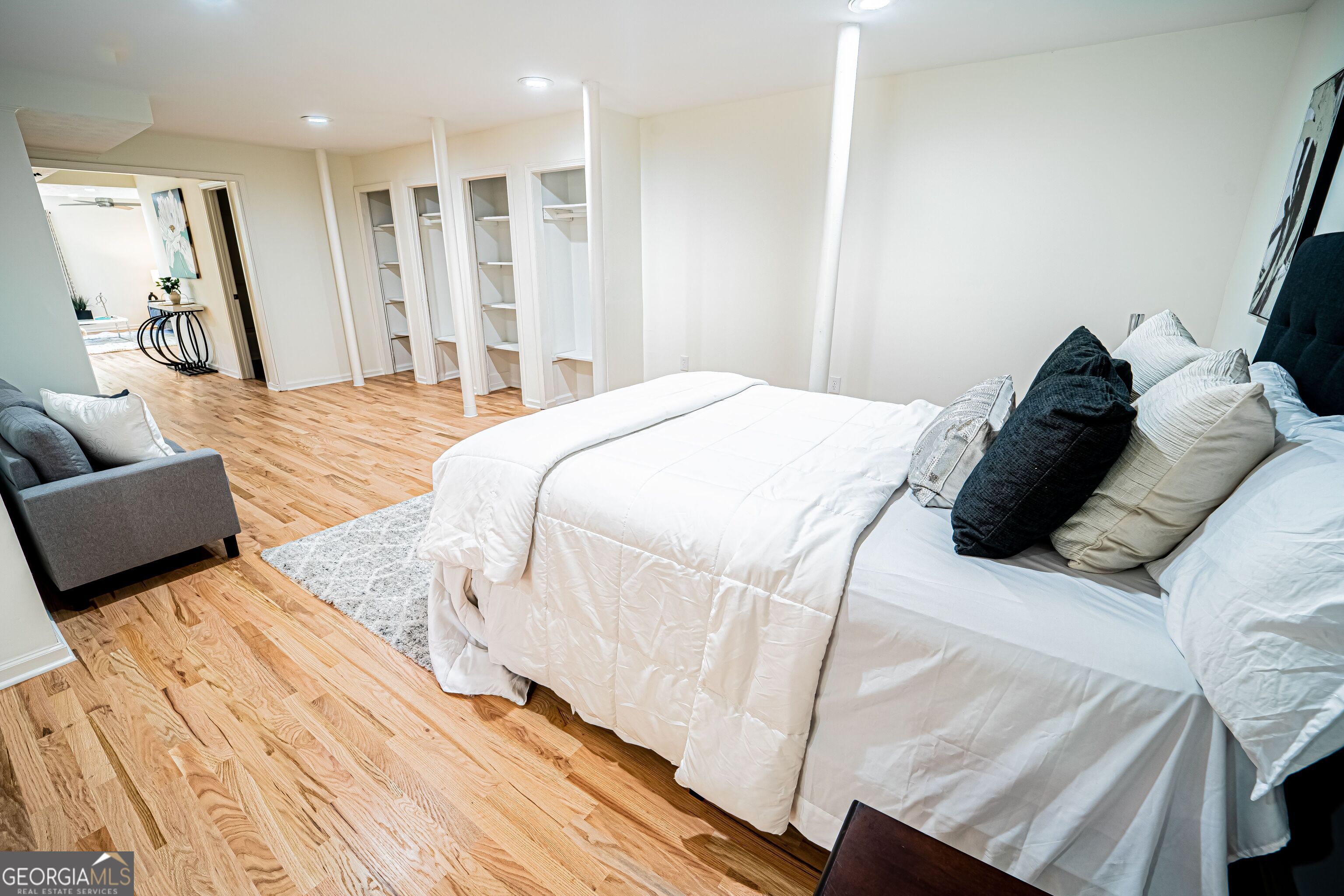 5205 Corinth Circle, Unit 3 Stone Mountain, GA 30087 - Photo 13 of 22 a bedroom with a bed and a couch