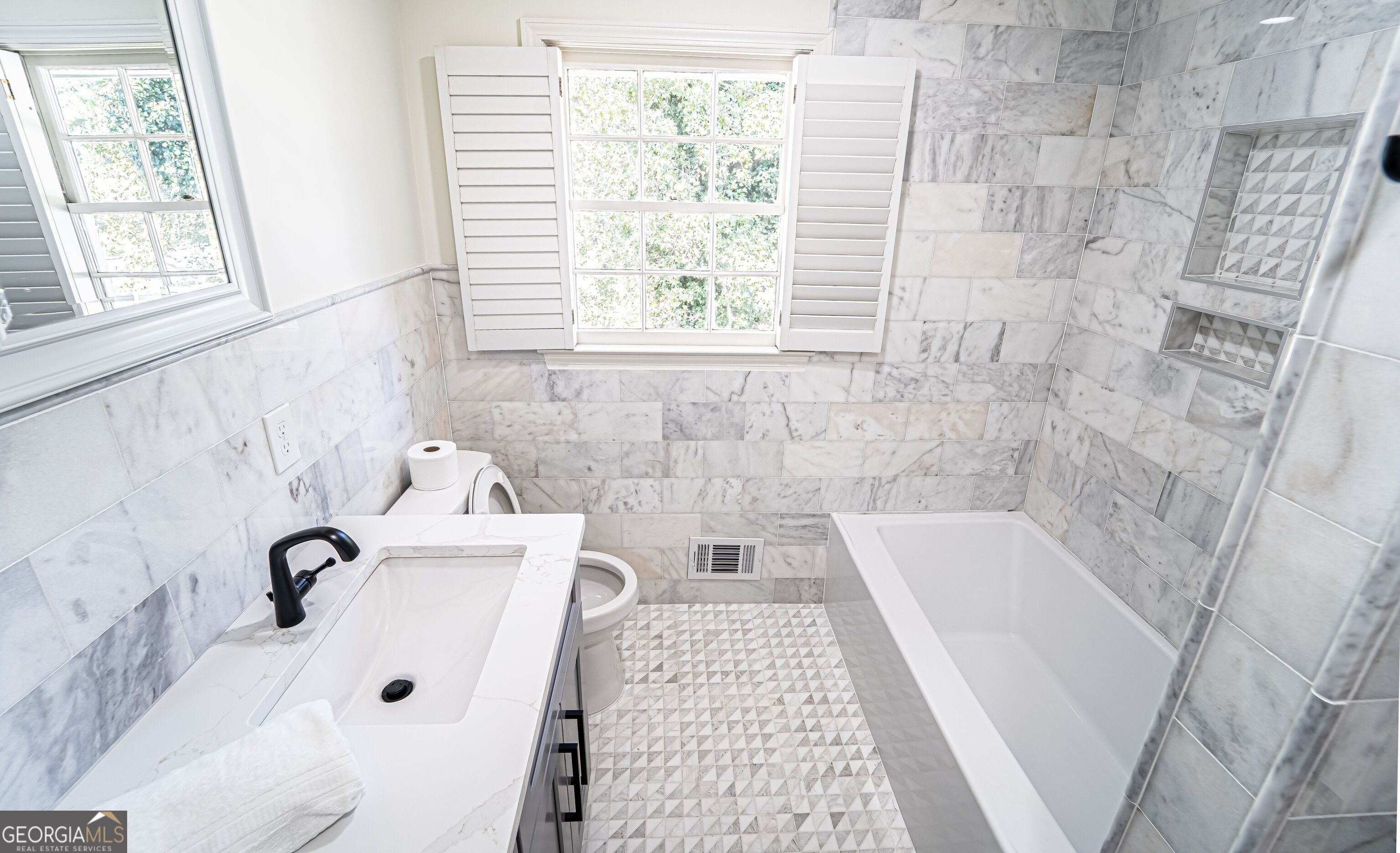 5205 Corinth Circle, Unit 3 Stone Mountain, GA 30087 - Photo 14 of 22 a bathroom with a bathtub and window
