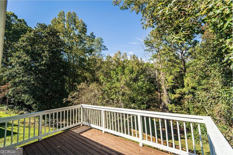 5205 Corinth Circle, Unit 3 Stone Mountain, GA 30087 - Photo 22 of 22 a view of balcony with wooden floor and fence