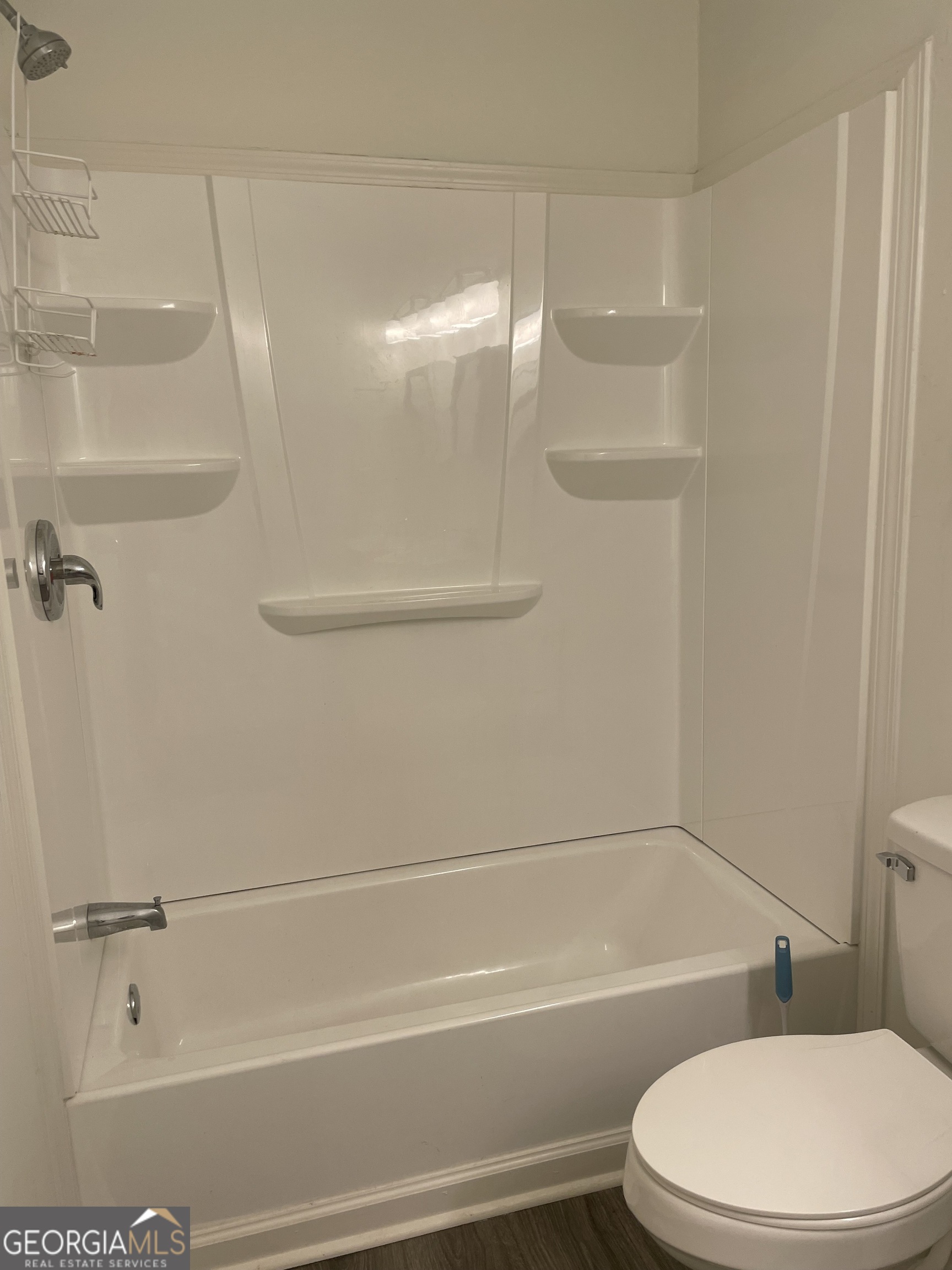 5205 Corinth Circle, Unit 3 Stone Mountain, GA 30087 - Photo 9 of 22 a bathroom with a toilet and a shower