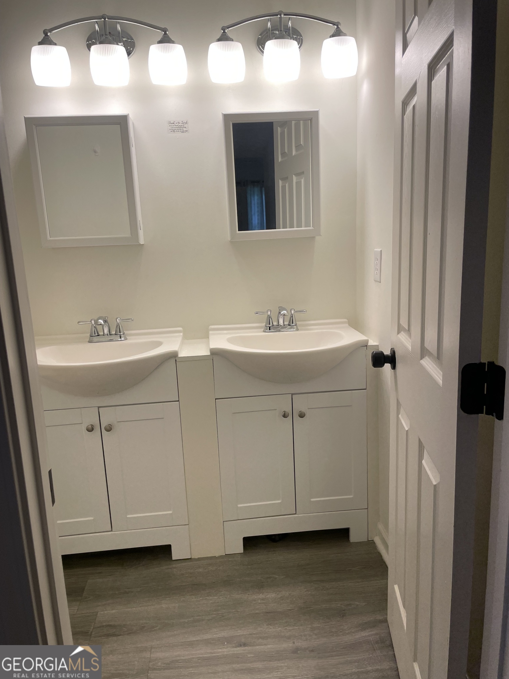 5205 Corinth Circle, Unit 3 Stone Mountain, GA 30087 - Photo 10 of 22 a bathroom with a sink and a mirror