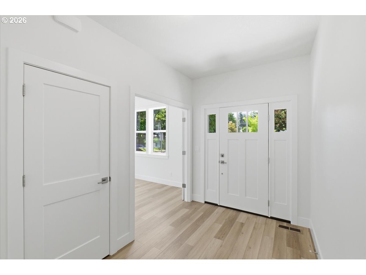 2147 Northeast Spitz Road Canby, OR 97013 - Photo 5 of 48 a view interior of a house and an entryway with wooden floor