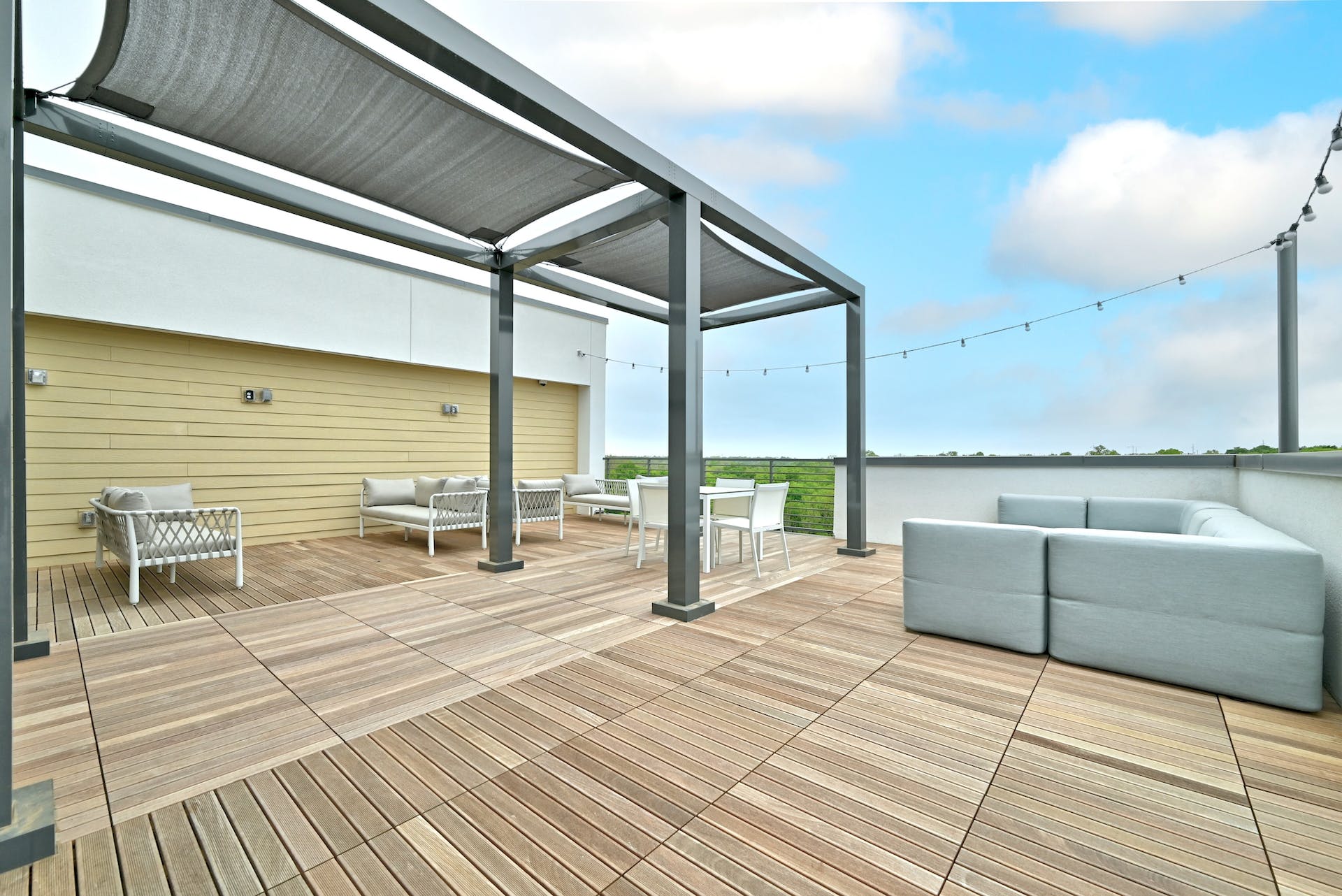 4801 Springdale Road, Unit 1301 Austin, TX 78723 - Photo 33 of 39 Unwind on this spacious rooftop patio, offering ample lounging and dining areas under a stylish pergola.