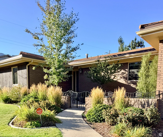 Brick exterior with vertical wood siding accents