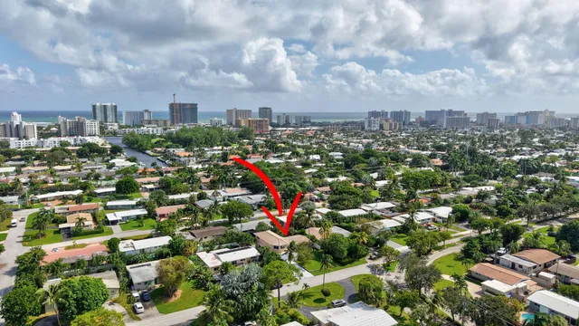 a view of kitchen with refrigerator and microwave