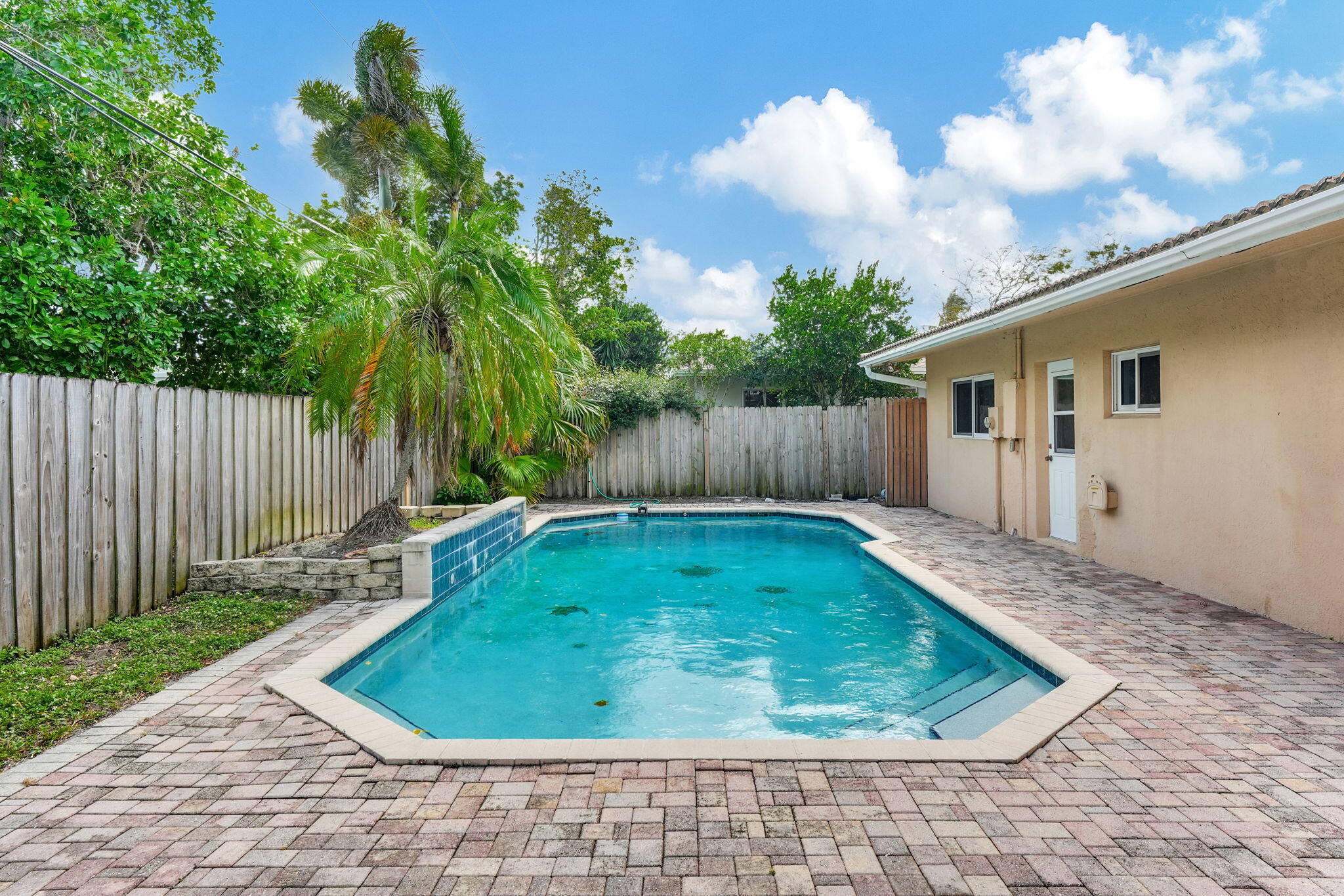1300 Northeast 26th Avenue Pompano Beach, FL 33062 - Photo 2 of 68 a view of a backyard with a small pool