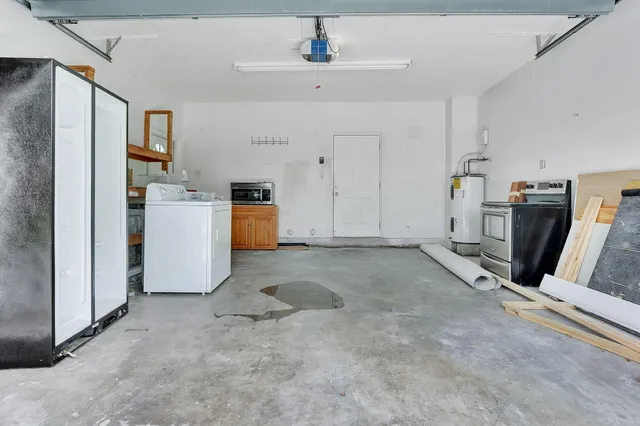a bathroom with a granite countertop sink mirror and toilet
