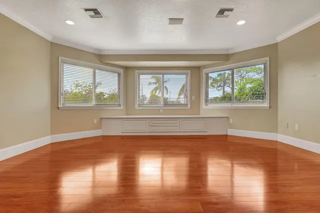 a view of room with hardwood floor and window