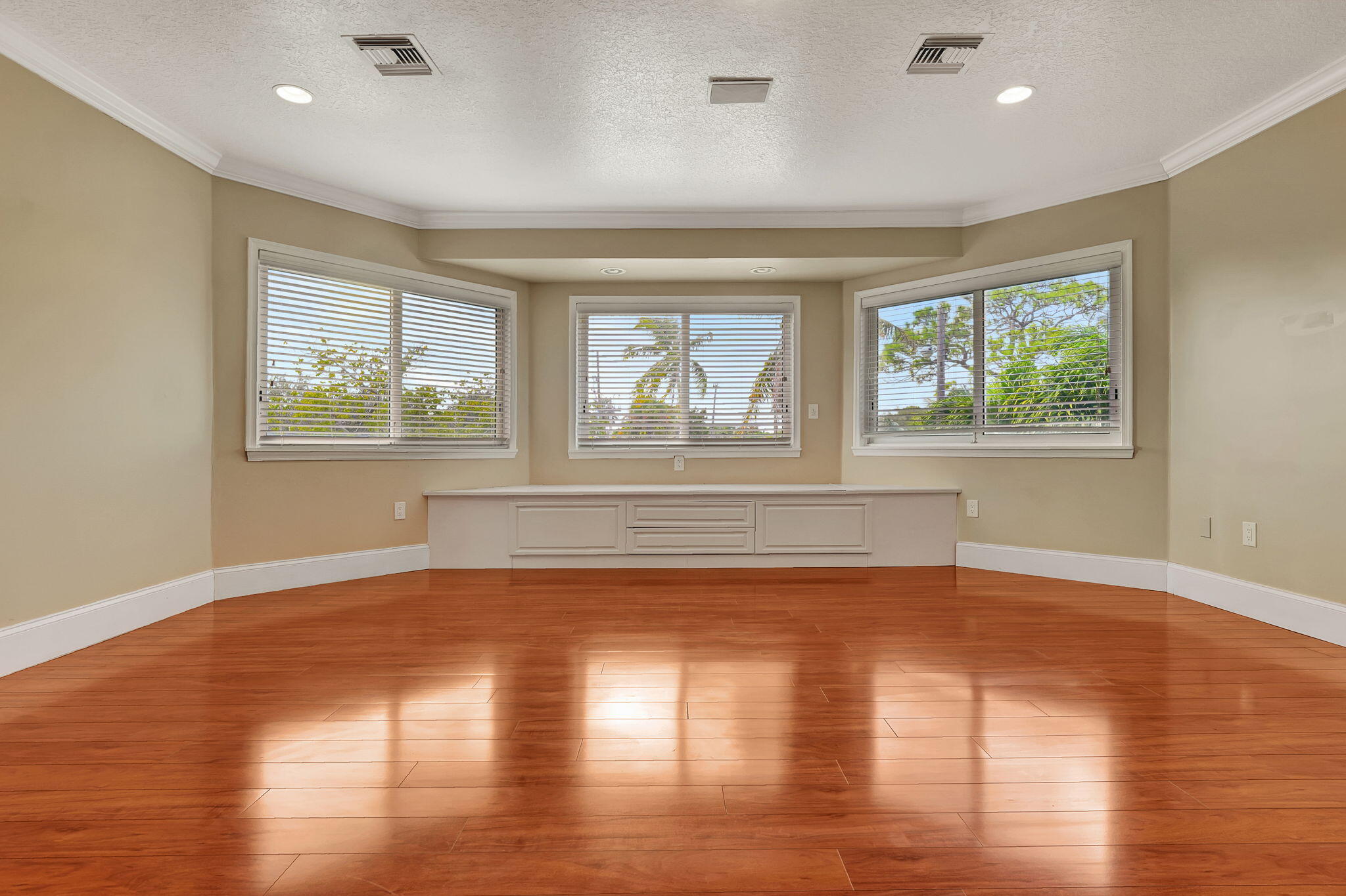 1300 Northeast 26th Avenue Pompano Beach, FL 33062 - Photo 34 of 68 a view of an empty room with wooden floor and a window