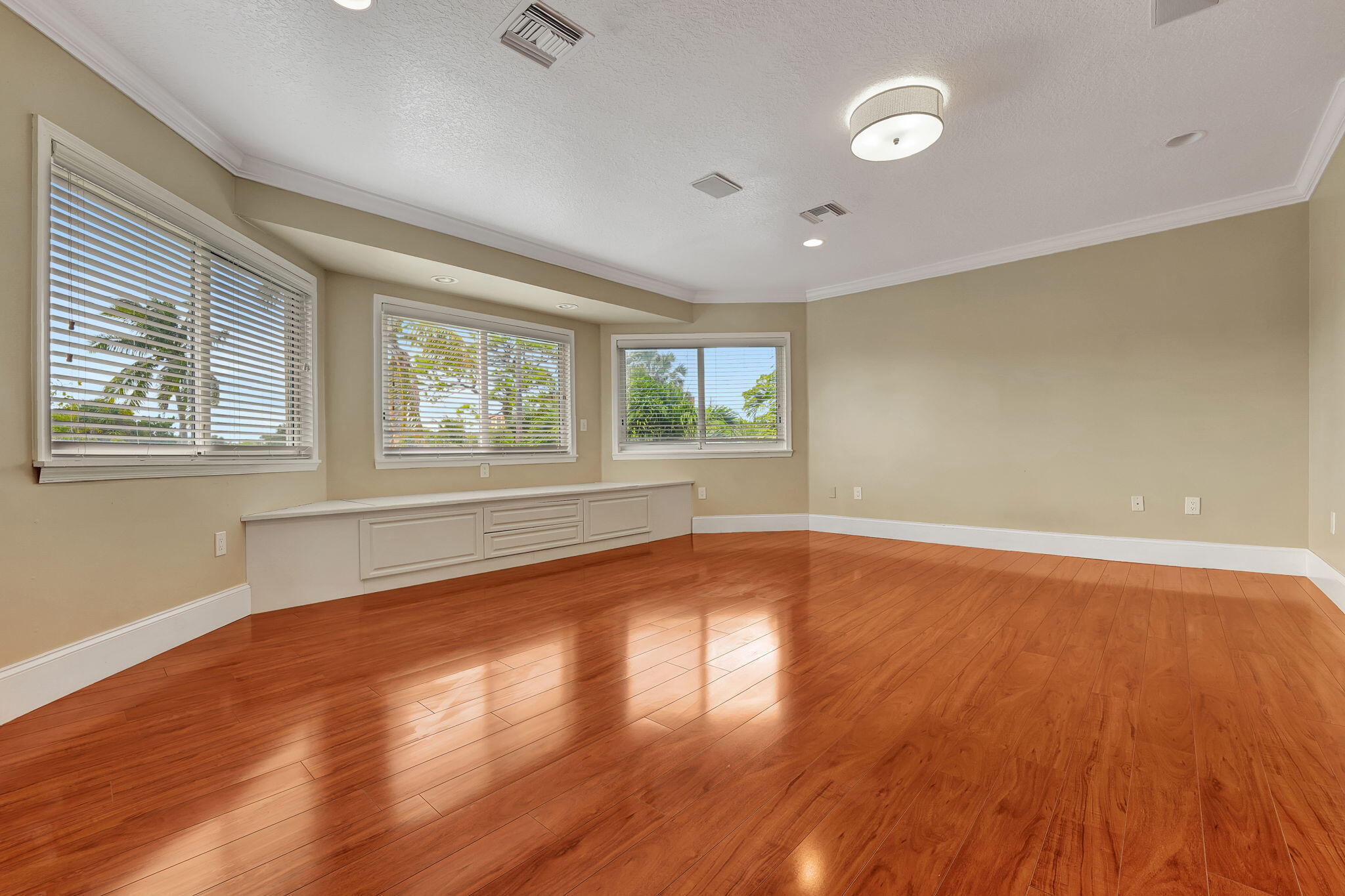 1300 Northeast 26th Avenue Pompano Beach, FL 33062 - Photo 36 of 68 an empty room with wooden floor and windows