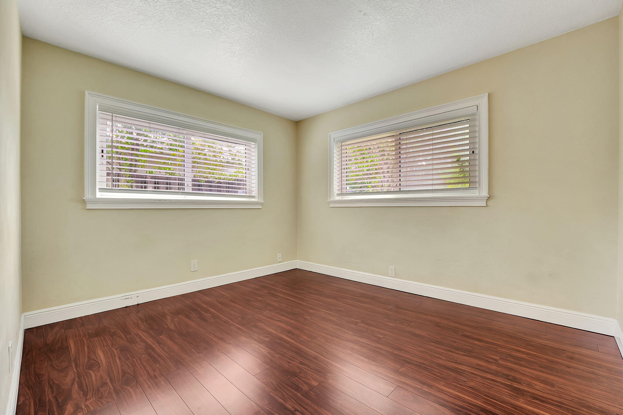 1300 Northeast 26th Avenue Pompano Beach, FL 33062 - Photo 42 of 68 a view of a room with wooden floor and windows