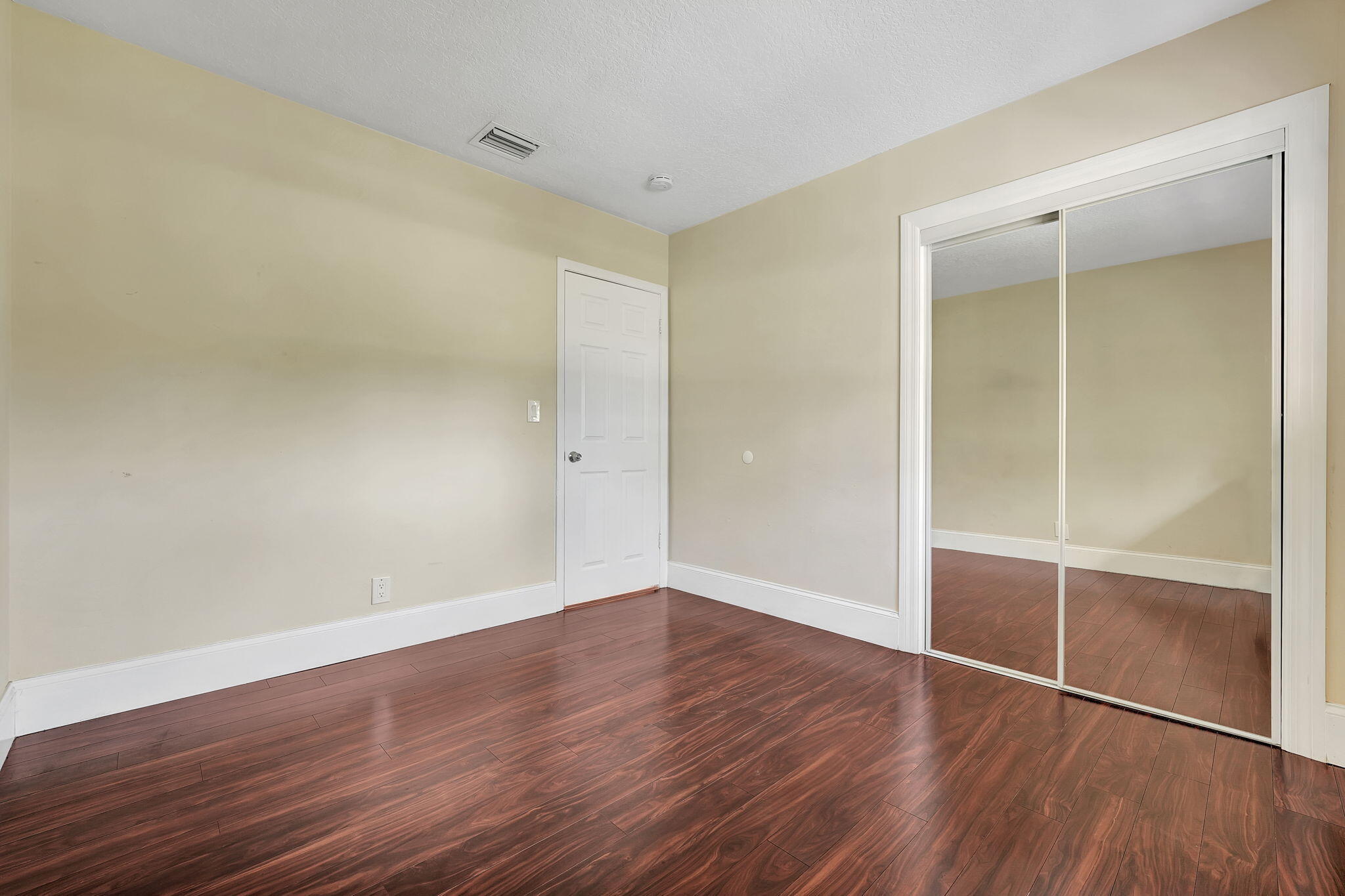 1300 Northeast 26th Avenue Pompano Beach, FL 33062 - Photo 44 of 68 a view of an empty room with wooden floor