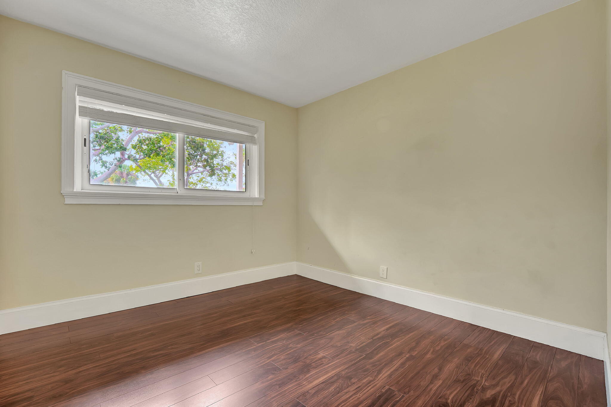 1300 Northeast 26th Avenue Pompano Beach, FL 33062 - Photo 45 of 68 a view of room with hardwood floor and window