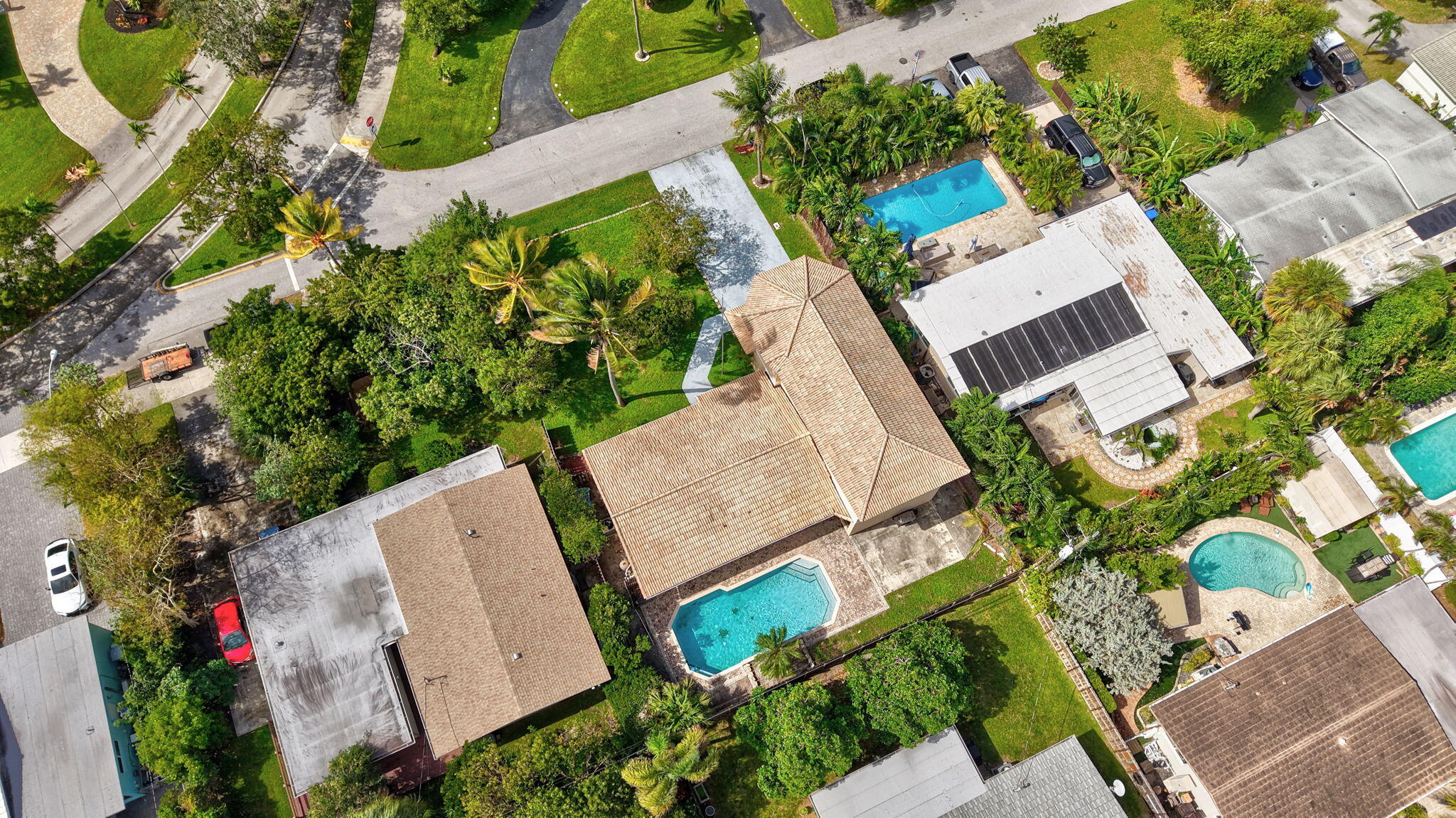 1300 Northeast 26th Avenue Pompano Beach, FL 33062 - Photo 5 of 68 an aerial view of a house with a yard and garden