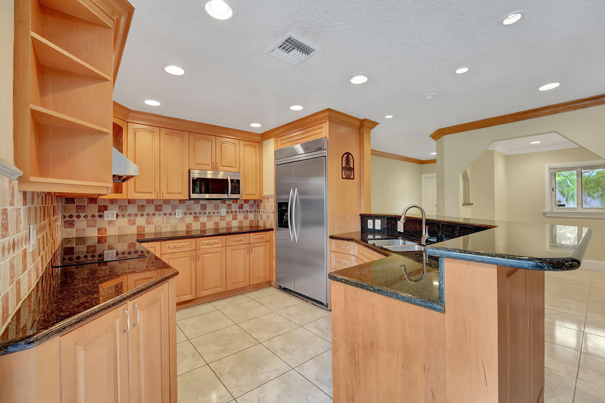 1300 Northeast 26th Avenue Pompano Beach, FL 33062 - Photo 61 of 68 a kitchen with stainless steel appliances granite countertop a sink and cabinets
